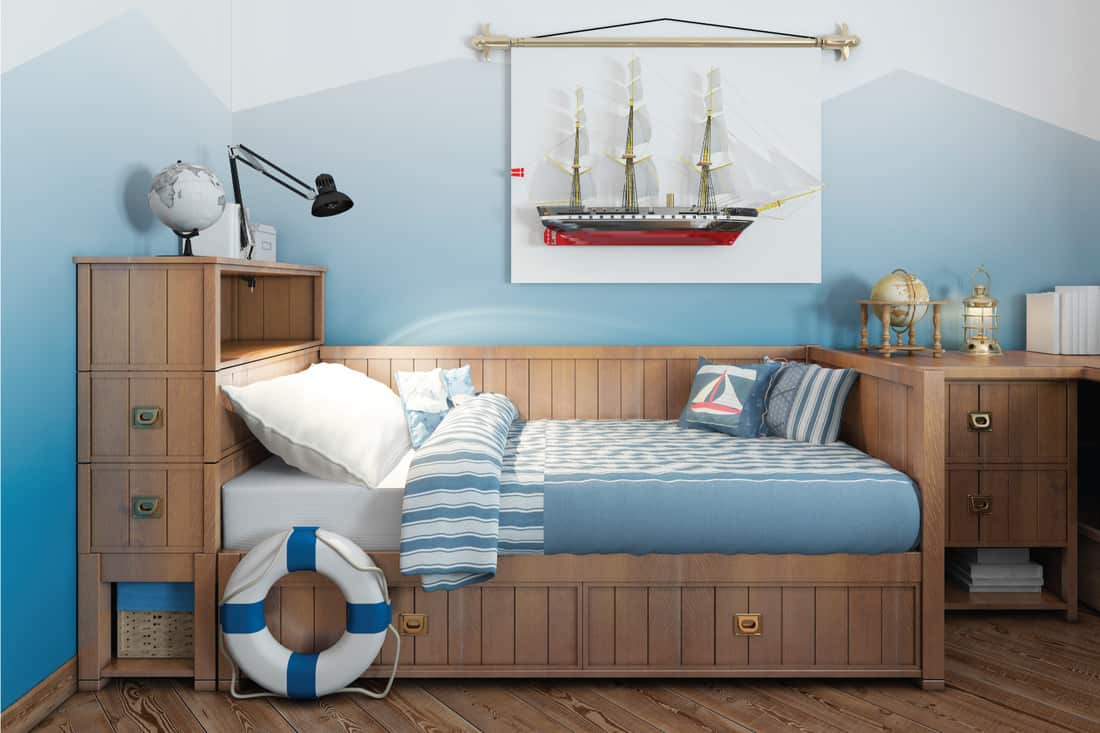 Baby bed for a young teenager in a ship style with a lifeline and nautical decor. Modern interior of a child's room in a nautical theme