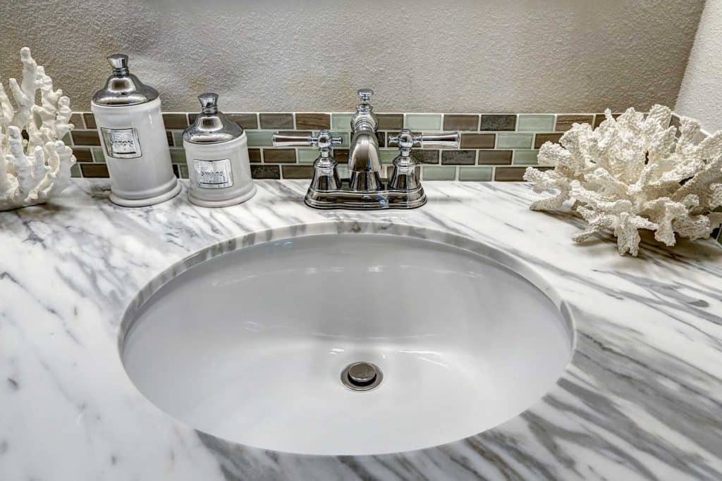 Bathroom vanity cabinet with white granite top
