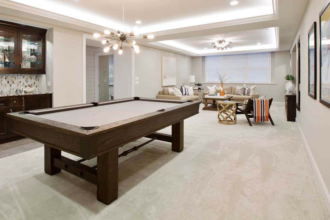 Beautiful basement entertaining room with LED lighting in tray ceiling, 11 Stunning Basement Flooring Ideas
