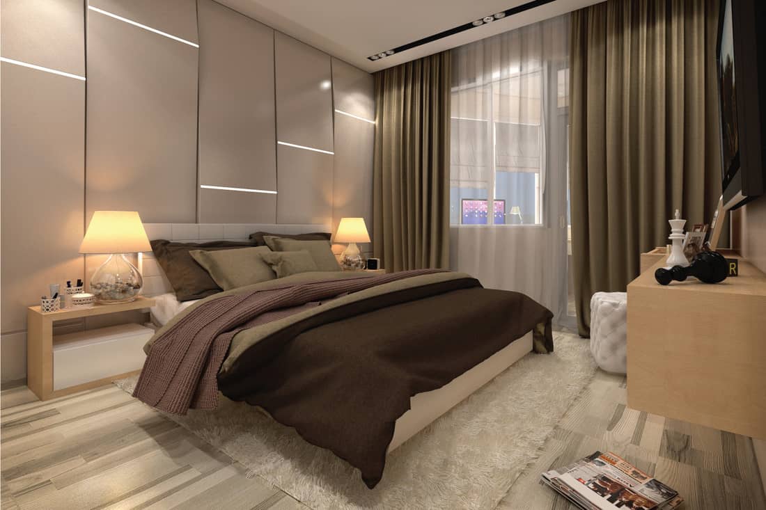 Bedroom in a private house in brown and beige colors. tan, greyish beige and a couple of darker colors that are done up with a muted, greyish tone