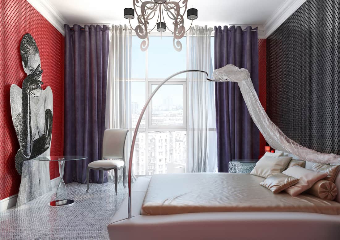 Bedroom with baldachin, red walls and purple curtains