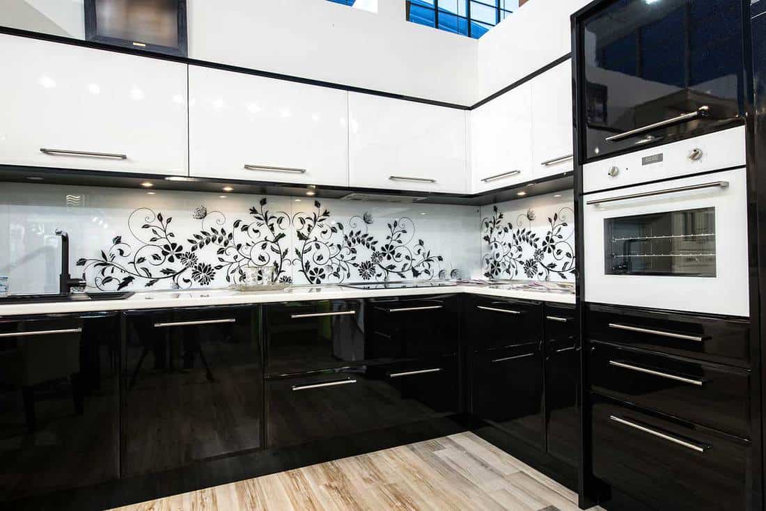 Black and white luxury kitchen interior with vinyl floor