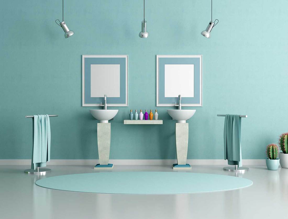 Blue and green bathroom with double sink