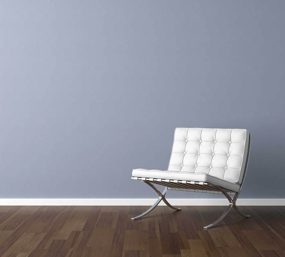 Blue wall with white chair interior design