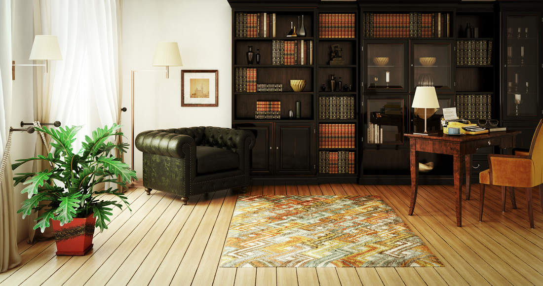 classical home interior (home library) with stylish furniture such as massive bookshelf, home office desk with typewriter and a very comfortable (perfect for reading a good book) Chesterfield armchair