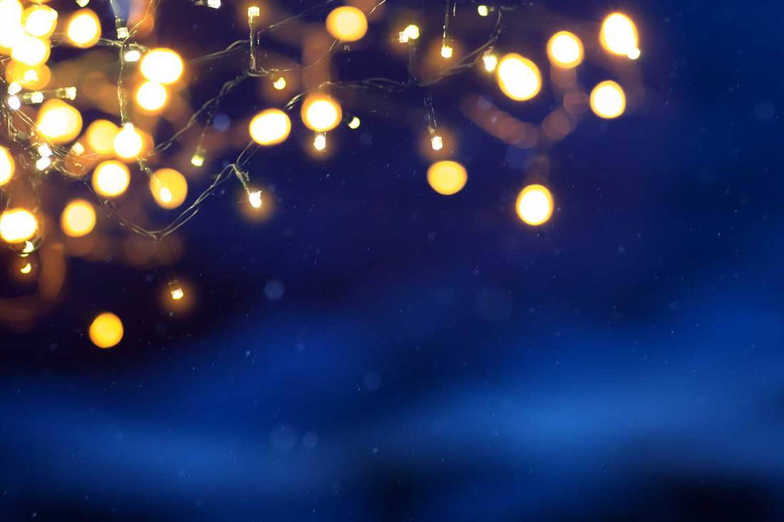 Christmas lights on dark blurry background