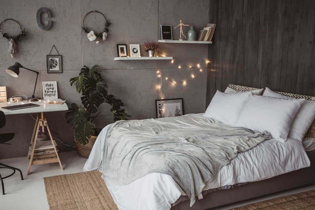 Cozy teen bedroom with study table and wall decor