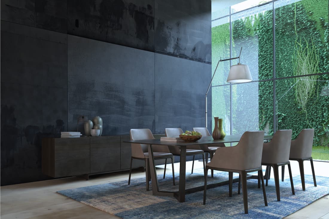 Dark-Themed Luxury Dining Room. sleek table, neutral-colored chairs, and the modern floor lamp