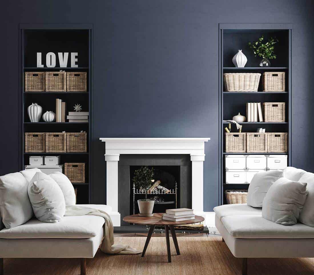 Eclectic home interior in classic blue wall and fireplace