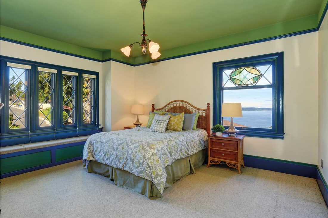 Green Ceiling, Cream Walls, And Bold Blue Trim