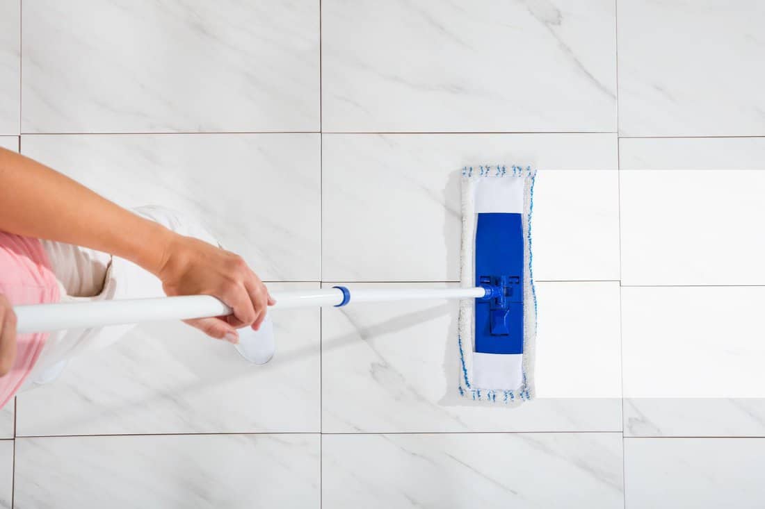 High Angle View Of Person Cleaning Floor With Mop 