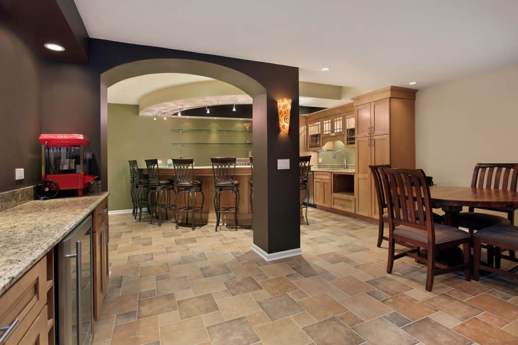 Lower level basement with tiled floor and bar 