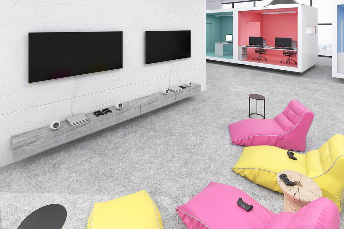 Modern game room office interior with lazy bags, TV screens, cubicle office and concrete floor