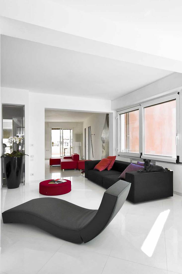 Modern living room with chaise lounge sofa and tiled floor