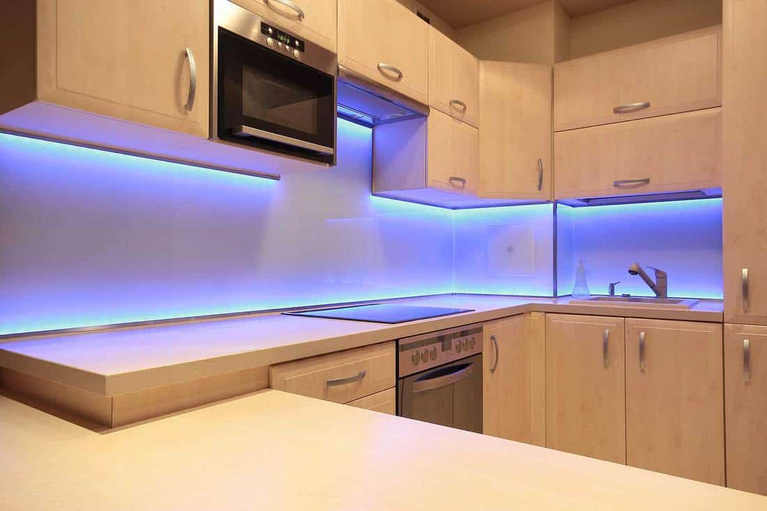 Modern luxury kitchen with purple LED lighting