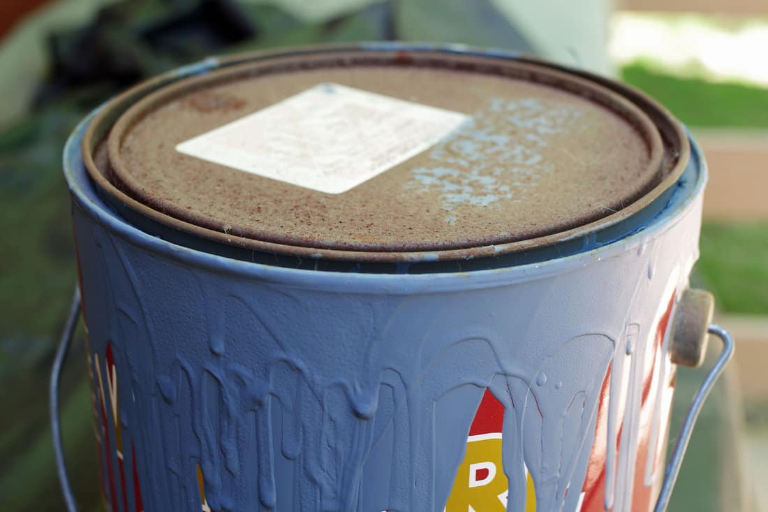 Old Paint Can with Dried Blue Paint Dripping down Side 
