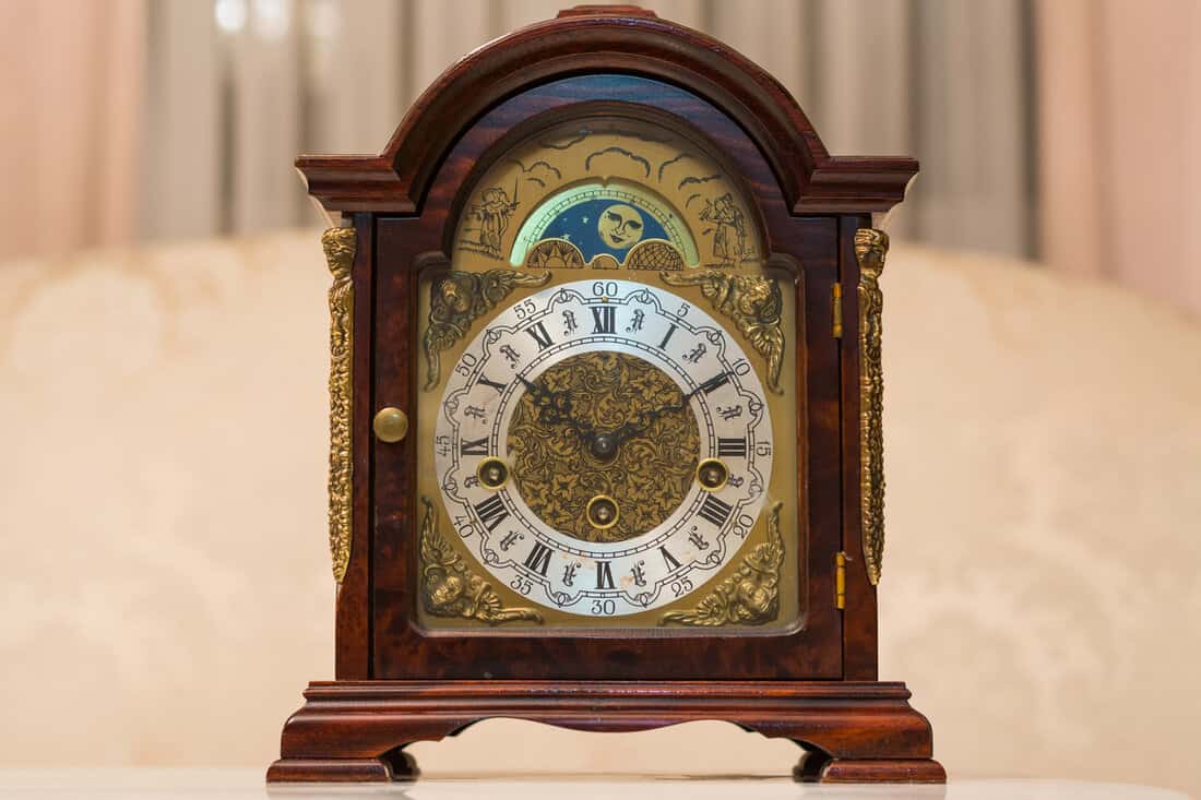 Old vintage clock made of wood.