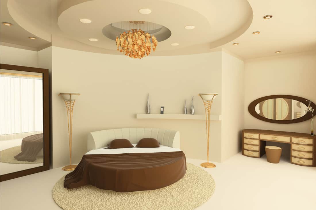 Round bed with a suspended ceiling in a luxurious bedroom. Match Beige Walls To A Beige Ceiling