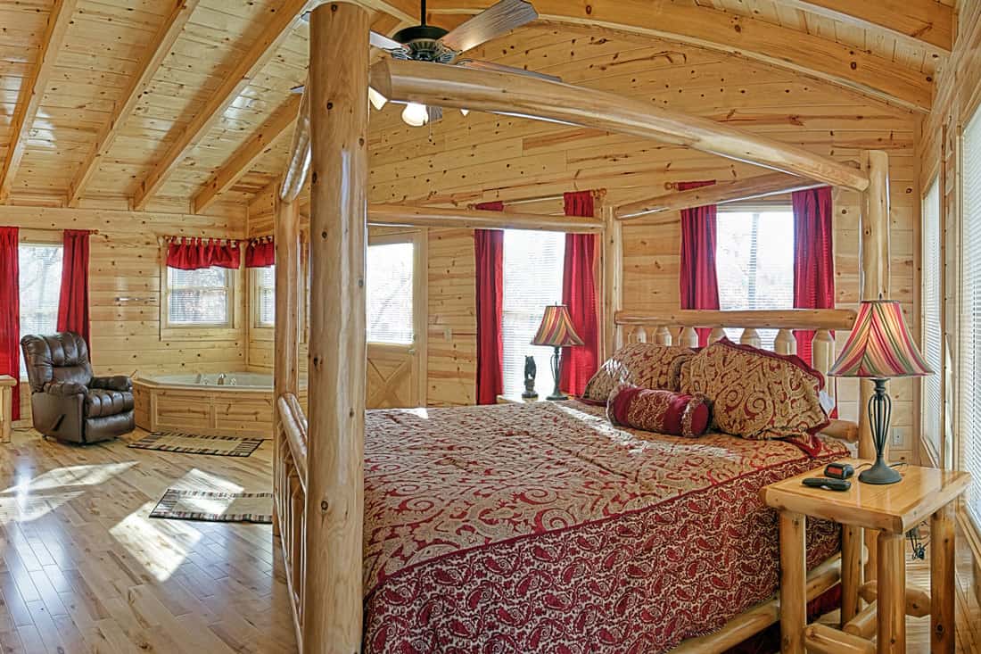 Rustic but modern cabin bedroom, wood paneled room with burgandry curtains, What Curtains Go With Wood Paneling?