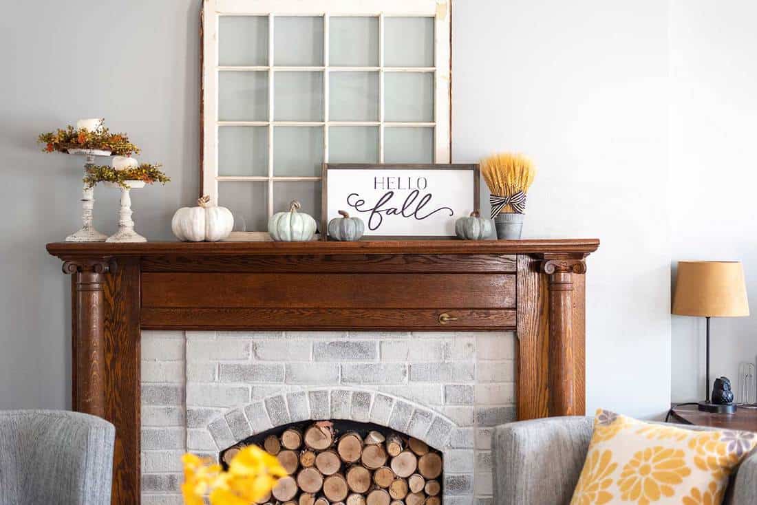 Stylish fall decorations on the mantel at home