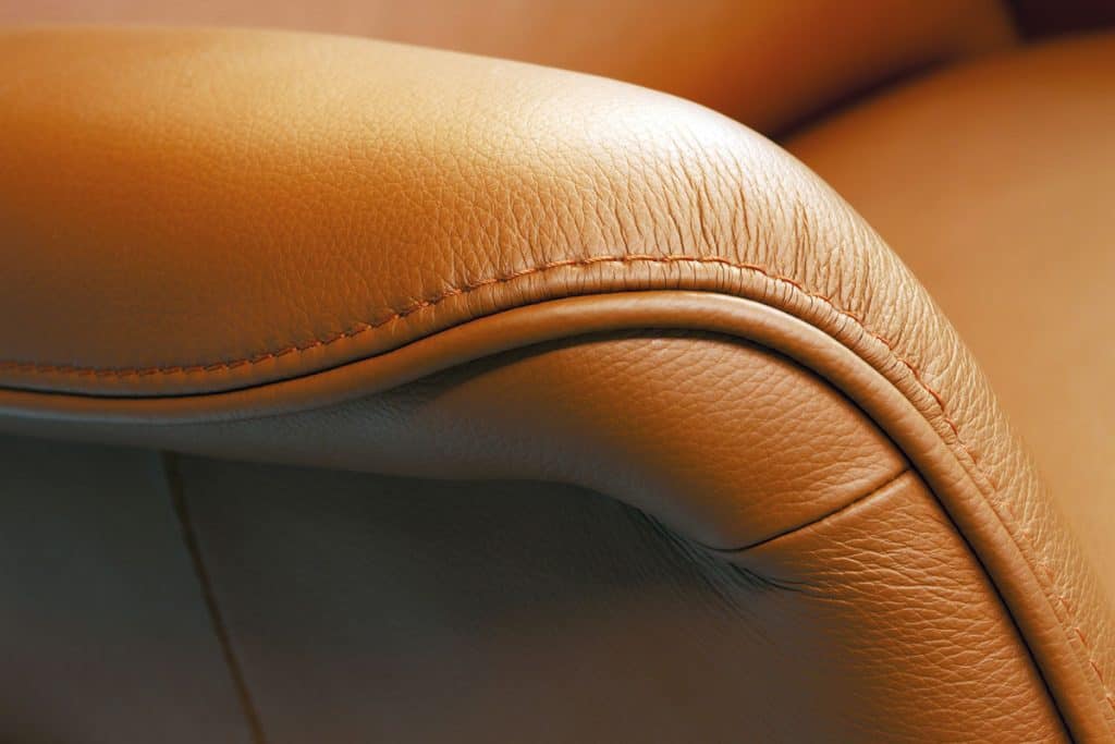Up close photo of a leather rustic chair