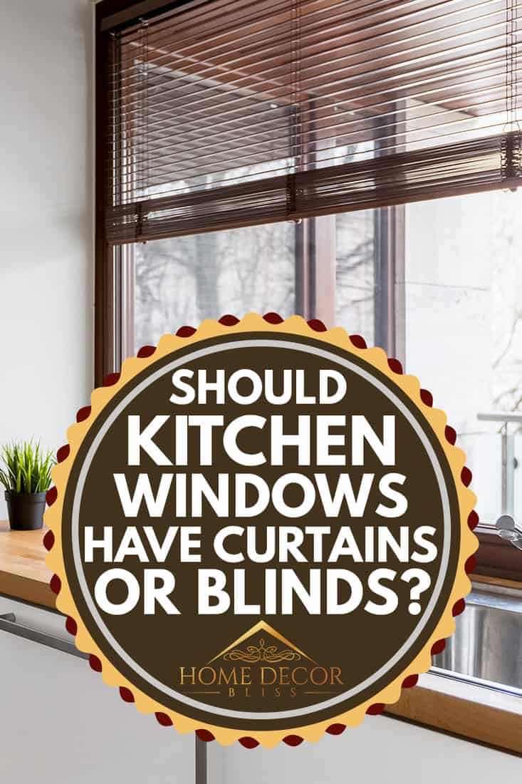 White kitchen with wooden countertop, kitchen window with blinds, Should Kitchen Windows Have Curtains Or Blinds?