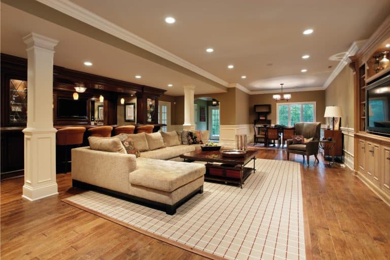 basement with bar, entertainment area, light wood floor with white rug, chaise lounge. What Color Rug Goes With Wood Floors