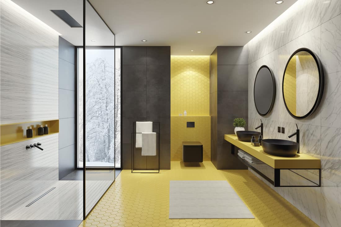 Bathroom with yellow honeycomb ceramic tiles and gray and marble large ceramic tiles long vanity unit with yellow corian stone finish