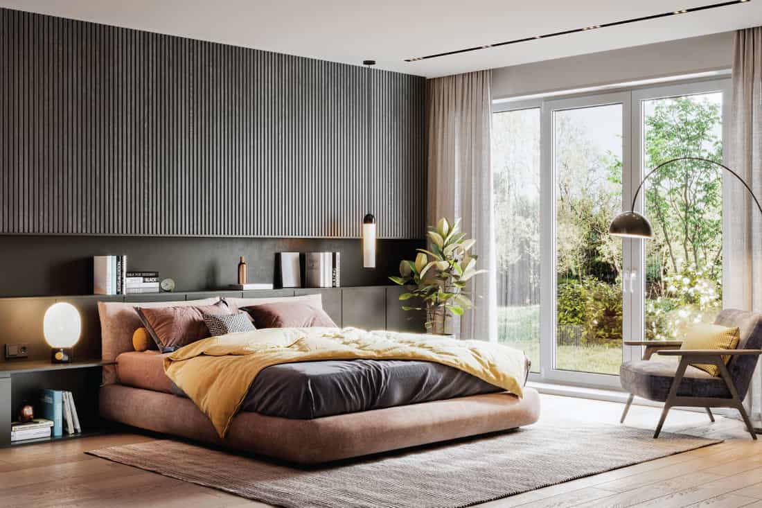 brown themed bedroom, gray wall, brown carpet, warm light. Soft Contemporary Lighting And Warm Tones