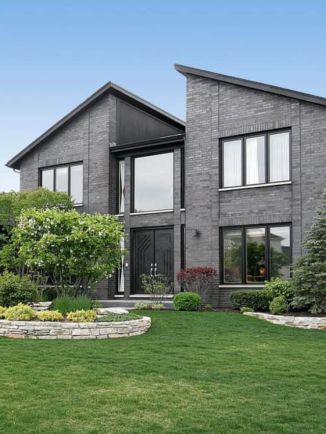 Luxurious contemporary mansion with huge picture windows, wedged roofing, gray decorative sidings, and a gorgeous front lawn landscaping, 17 Eye-Catching Grey House Ideas