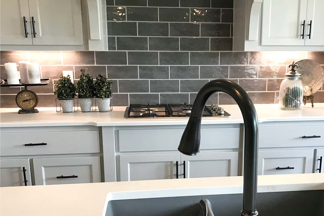 Kitchen with sink and cabinet knobs with black matte or flat finish