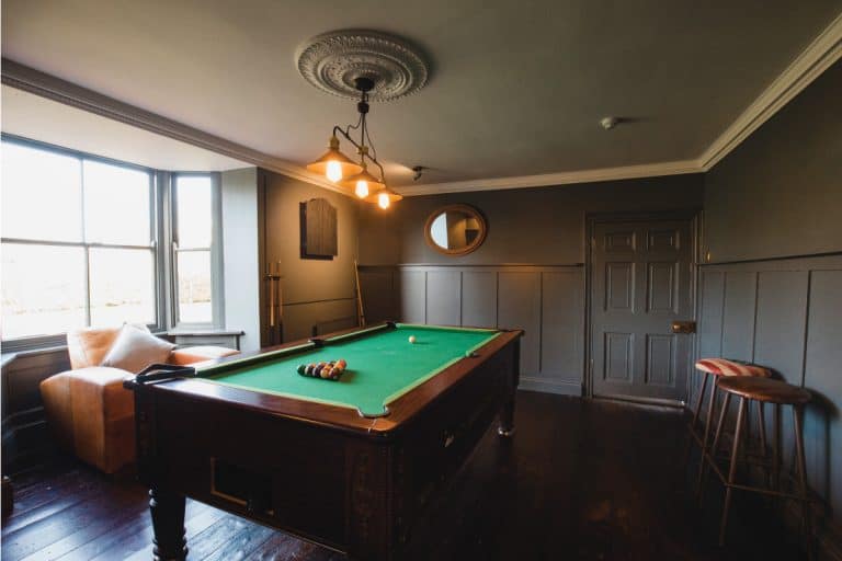 modern game room with billiard table in the middle. How To Decorate A Home Game Recreation Room