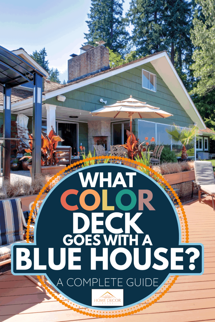 suburuban blue home backyard with reddish brown deck. What Color Deck Goes With A Blue House [A Complete Guide]