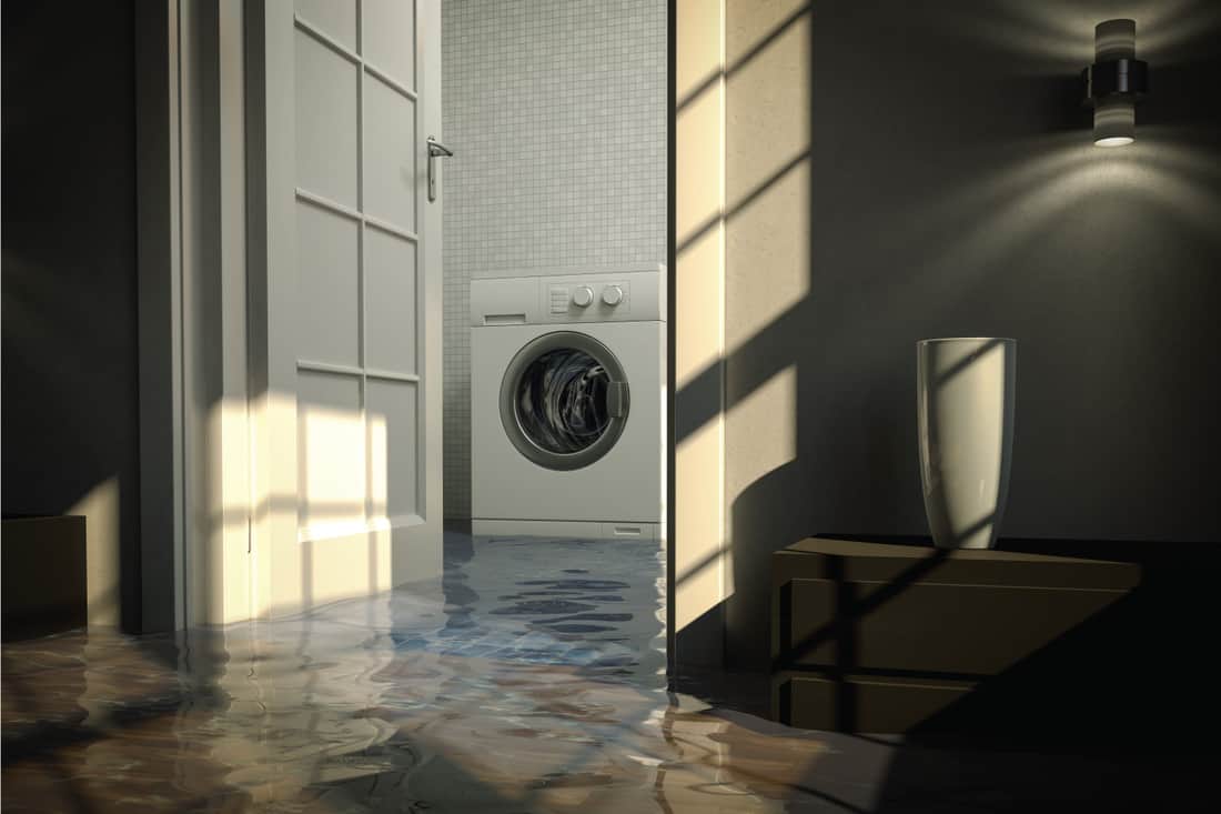 washing machine inside a flooded laundry room