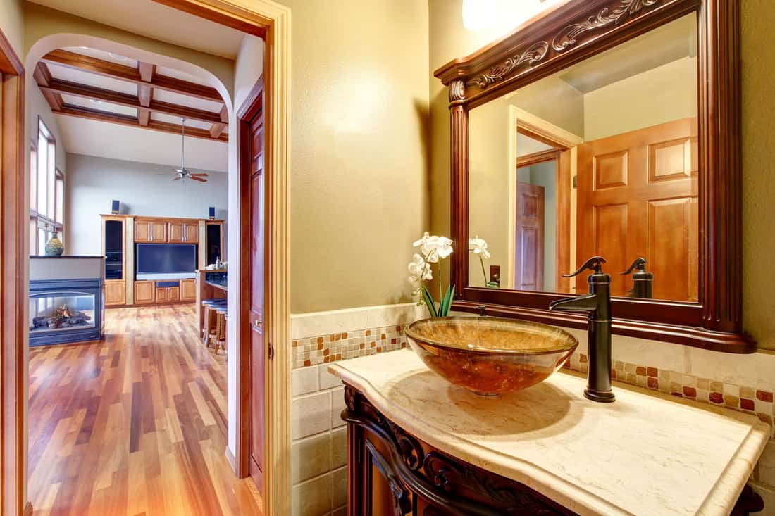 A gorgeous rustic interior of a farmhouse themed bathroom, How Big Should A Vessel Sink Be?