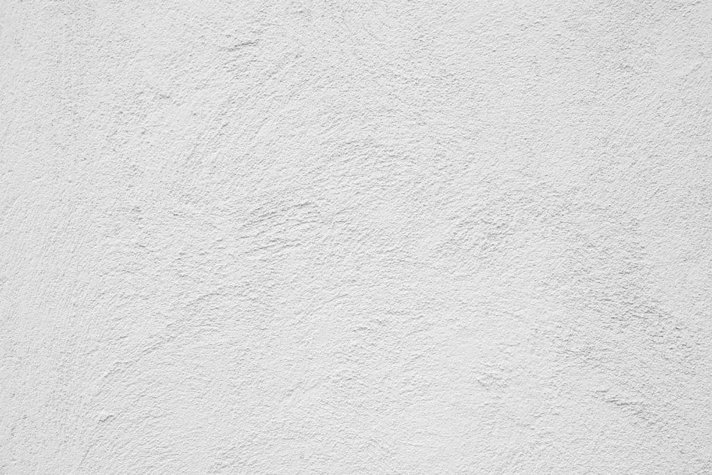 Abstract Grunge Decorative White Stucco Wall Texture. Whitewashed Rough Background With Copy Space. White Horizontal Web Banner.