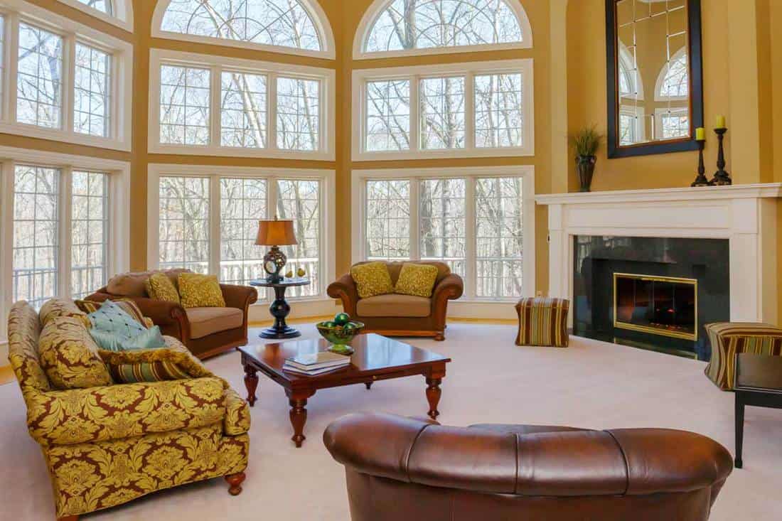 Amazing great room with vaulted ceiling and two story windows, 10 Amazing 20x25 Living Room Layout Ideas