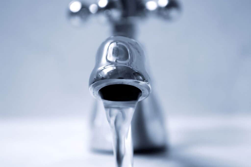 An up close photo of a faucet