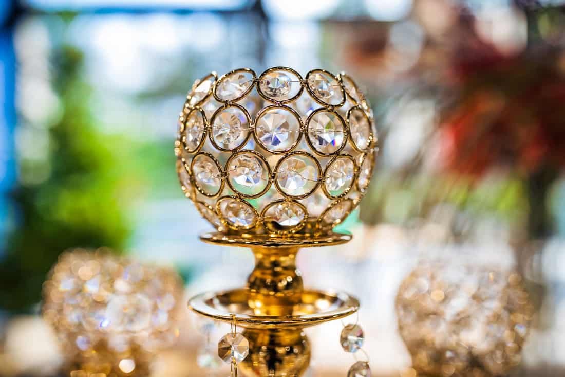 Close up image of crystal on chandelier with bokeh background