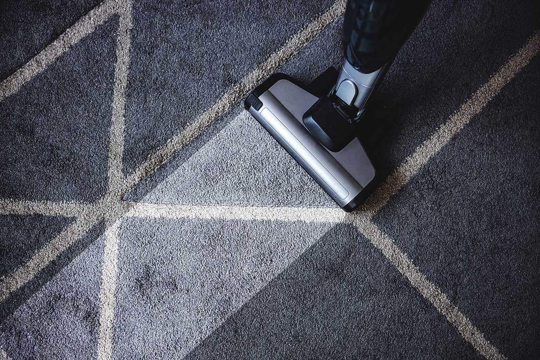 Close up of steam cleaner cleaning carpet
