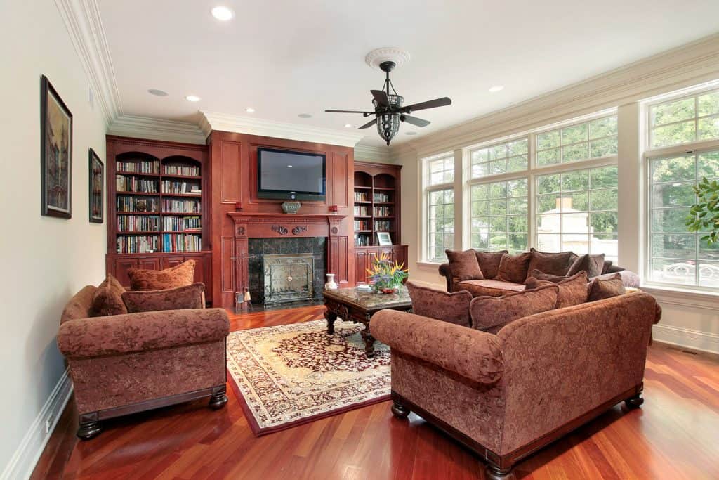 Family room with fireplace and cherry wood flooring