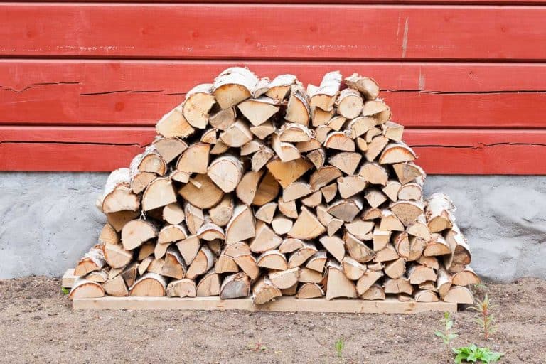 Firewood pile stored outside house, How Big Is A Rick Of Wood?