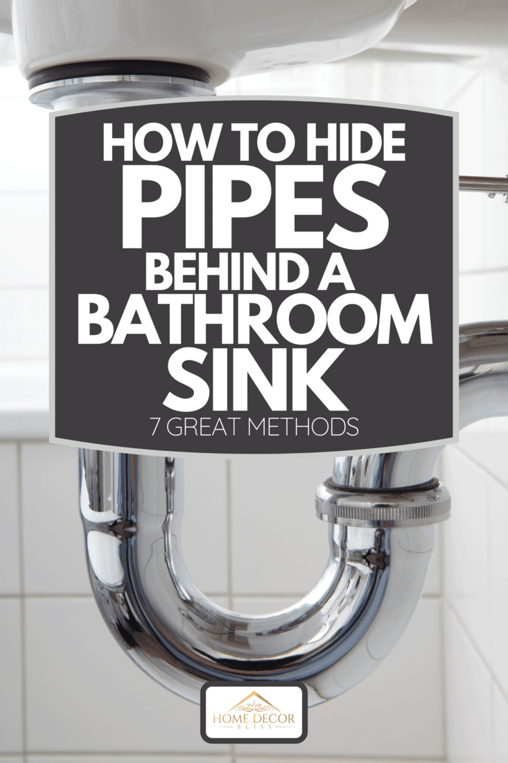 A sink pipe under wash basin in white bathroom, How To Hide Pipes Behind A Bathroom Sink [7 Great Methods]