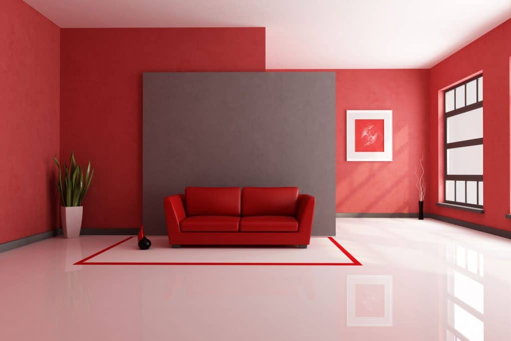 Huge and spacious interior of a red colored inspired living room