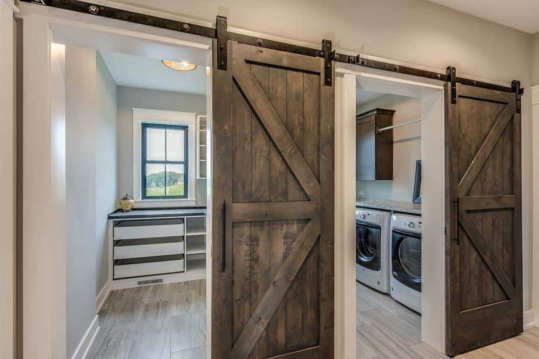 Huge laundry room with barn doors entrance