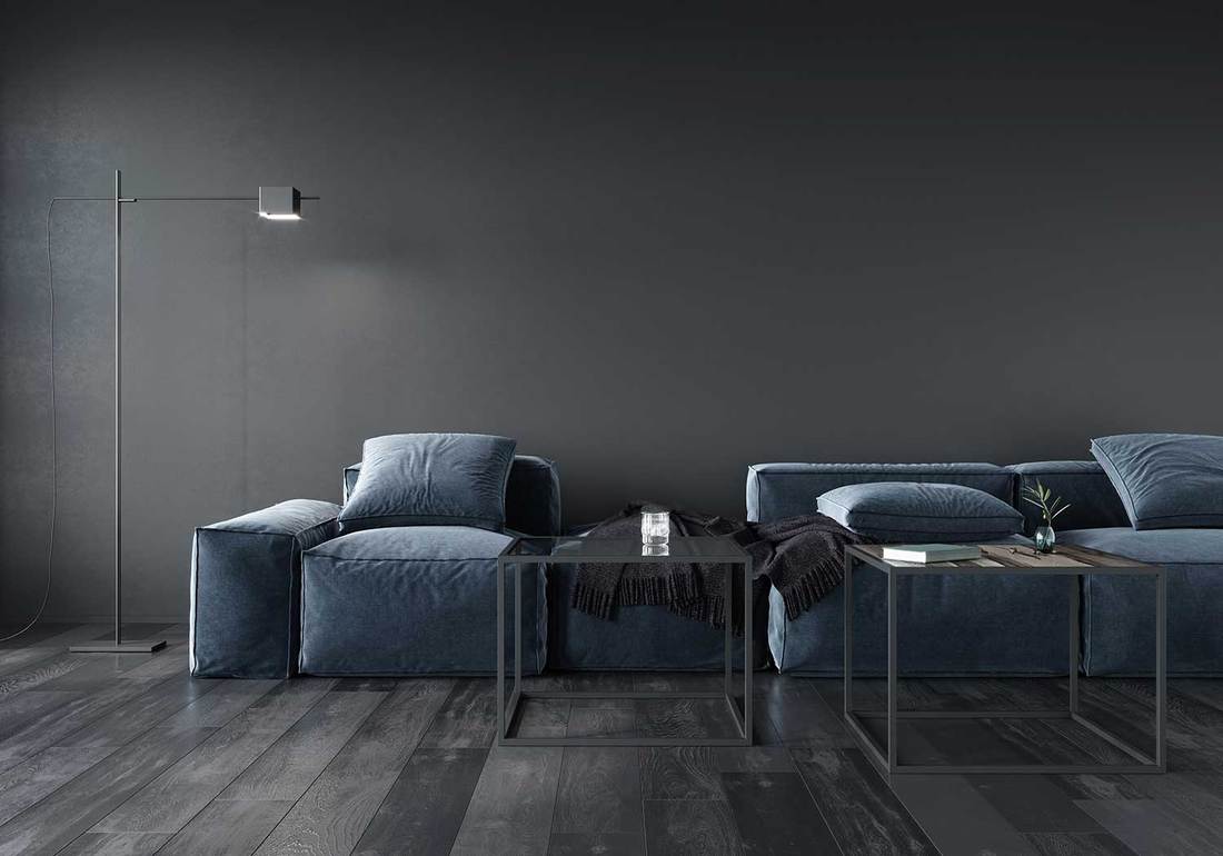 Living room interior with soft minimalist blue sofa, floor lamp and metal table