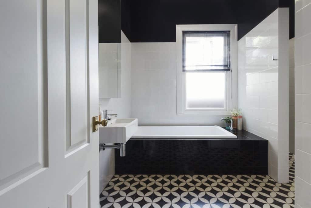 Luxurious bathroom with black and white tiles