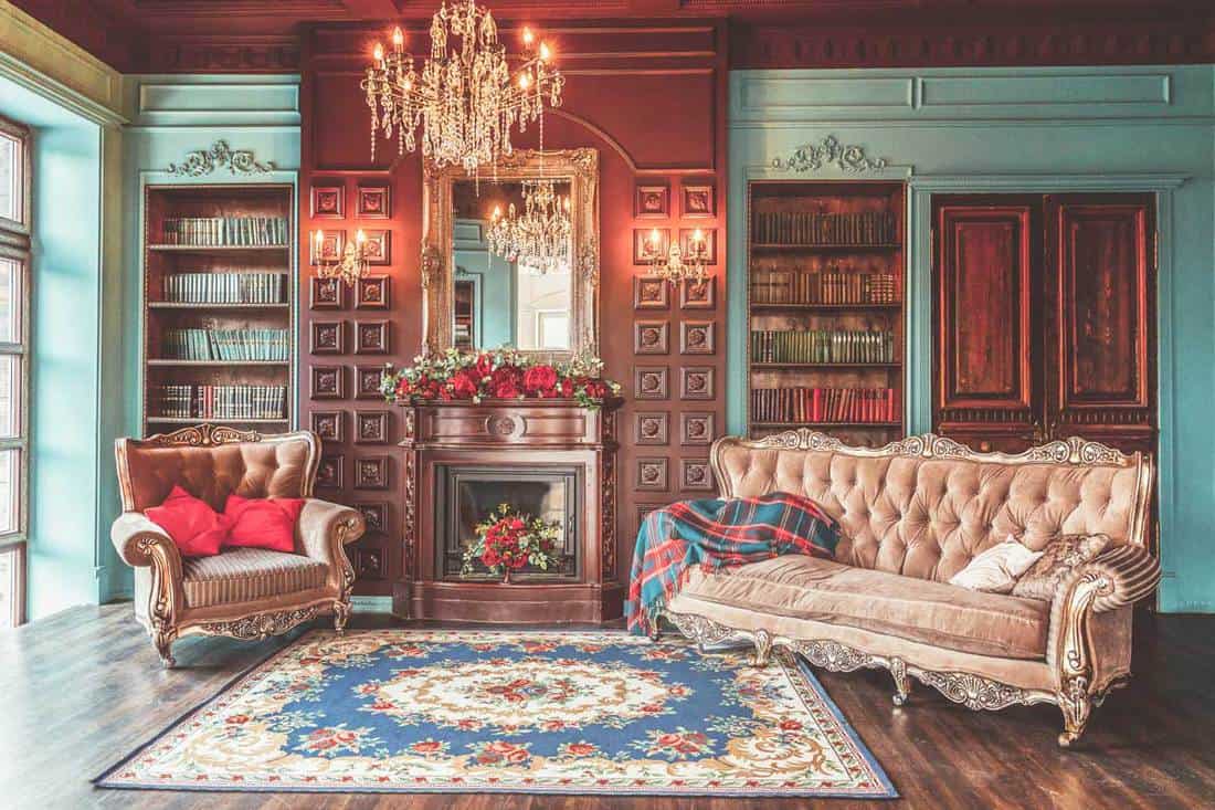 Luxury hacienda style interior living room with bookshelf, books, arm chair, sofa and fireplace, 21 Hacienda Style Living Room Ideas