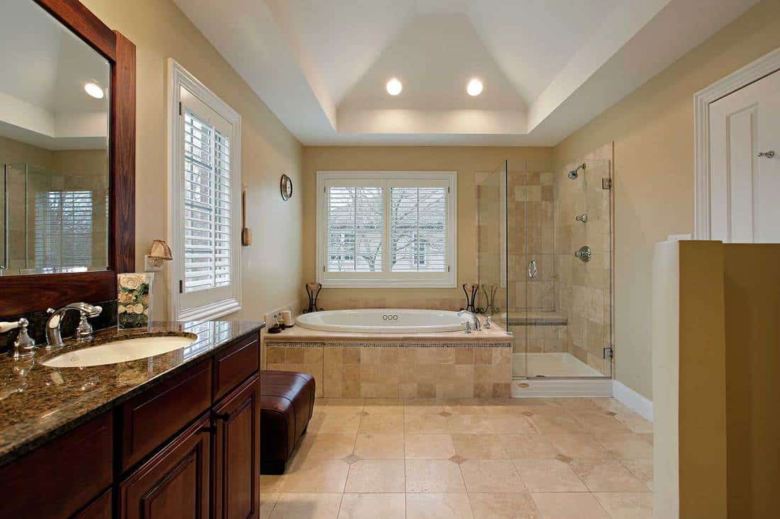 Master bathroom with glass shower and bathtub