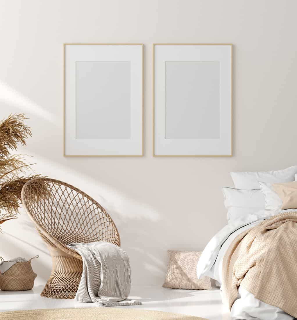Mock up frame in bedroom interior, beige room with natural wooden furniture, Scandinavian style